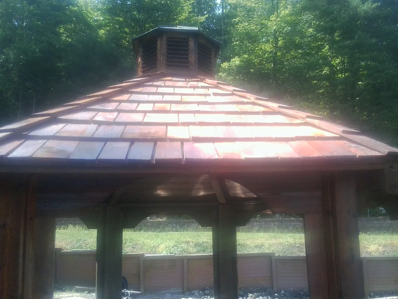 New cedar shake roof and cupola on a lakeside gazebo in Gainesville